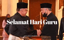 two men shaking hands with the words selamat hari guru behind them