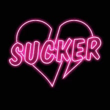 a neon sign with the word sucker inside of a heart