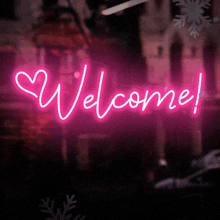 a neon sign that reads welcome with a heart in the middle