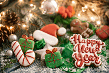 a happy new year sign is surrounded by christmas decorations