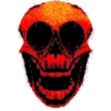 a red and black skull with a smile on it 's face .