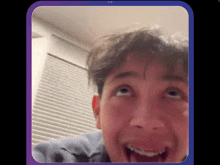 a young man with braces on his teeth looks at the camera