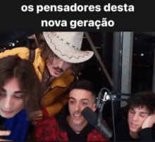 a group of young men are sitting in front of a microphone with the words " os pensadores desta nova geracao " above them