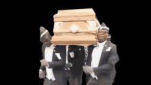 three men in tuxedos are carrying a coffin on a black background