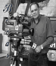 a man standing in front of a camera with a license plate that says apq-568