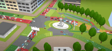 an aerial view of a busy intersection with a statue in the middle of it