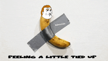 a banana is taped to a wall with duct tape and the words peeling a little tied up