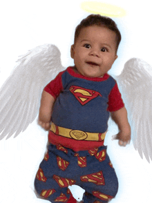 a baby wearing a superman costume with wings