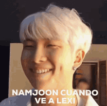 a close up of a person 's face with the words " namjoon cuando ve a lexi " on it