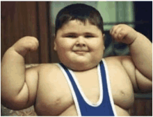 a young boy is flexing his muscles while wearing a blue and white tank top