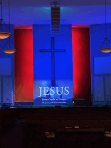 jesus from cradle to crown is displayed on a large screen