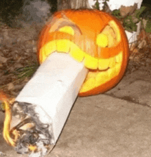 a pumpkin with a cigarette carved into it