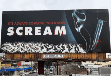 a billboard that says scream on it