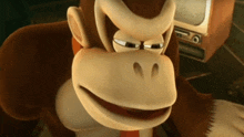 a close up of donkey kong 's face in front of a tv