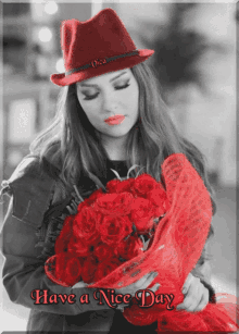 a black and white photo of a woman holding a bouquet of red roses with the caption have a nice day