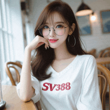 a woman wearing glasses and a white shirt with sv388 on it