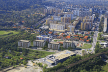 an aerial view of a city with lots of tall buildings