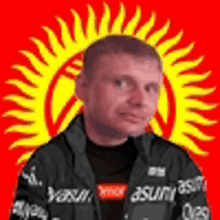 a man is standing in front of a yellow sun on a red background .