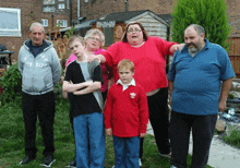 a group of people are posing for a picture and one of them is wearing a shirt that says th dept.