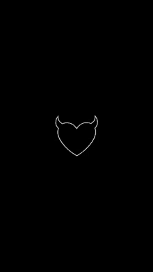 a heart with horns on a black background