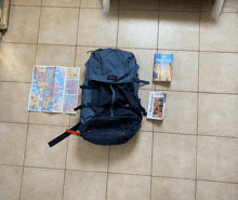 a book titled new york sits next to a blue backpack