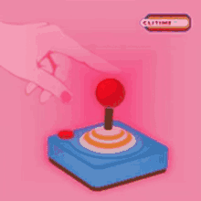 a hand is pressing a red button on a video game controller on a pink background .