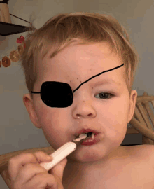 a child with a black eye patch on his eye