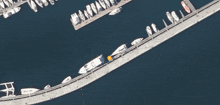 an aerial view of a dock with boats docked and a yellow circle pointing to the location of a boat