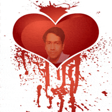 a picture of a man in a heart surrounded by blood splashes