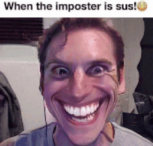 a man is smiling while wearing headphones and the caption says when the imposter is sus .