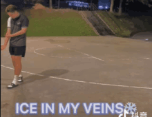 a man standing on a basketball court with the words " ice in my veins " above him