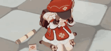 a girl in a red and white dress with a clover on it is kneeling down