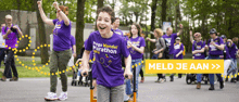 a boy wearing a purple shirt that says mega wandel marathon on it