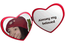 a heart shaped mirror that says aimsey my beloved on it