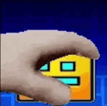 a cat 's paw is reaching out towards a yellow house in a pixel art video game .