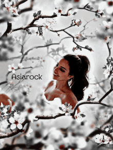 a picture of a woman surrounded by flowers with asiarock written on the bottom