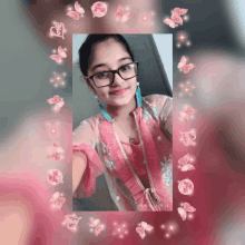 a girl wearing glasses takes a selfie in a pink frame with butterflies around her