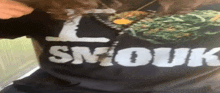 a person is wearing a shirt that says smouk