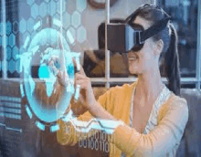 a woman is wearing a virtual reality headset while looking at a globe .