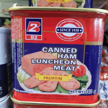 a can of canned ham luncheon meat is on a shelf