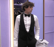 a man in a tuxedo with a bow tie