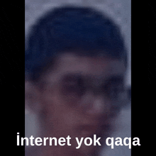 a blurry picture of a man with the words internet yok qaga written below him