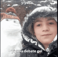 a young boy standing next to a snowman with the words yiyosa debate gel below him