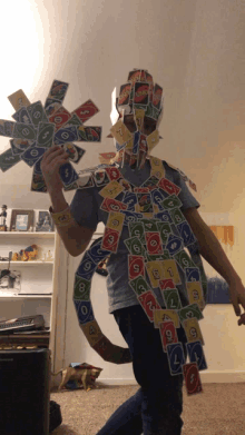 a person is wearing a costume made out of playing cards including uno