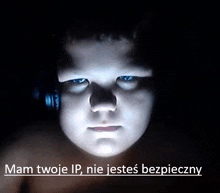 a boy wearing headphones looks at the camera with the words " mam twoje ip nie jestes bezpieczny " above him