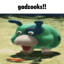 a cartoon character is walking on the ground with a carrot in its mouth and the words gadzooks written above it .