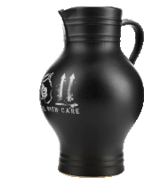 a black pitcher with the words " deal with care " on it