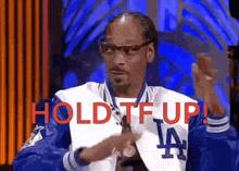 snoop dogg wearing a la dodgers jacket says hold it up