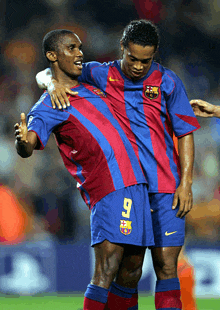 two soccer players one of whom has the number 7 on their shorts