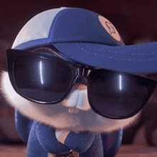 a stuffed animal is wearing sunglasses and a hat .